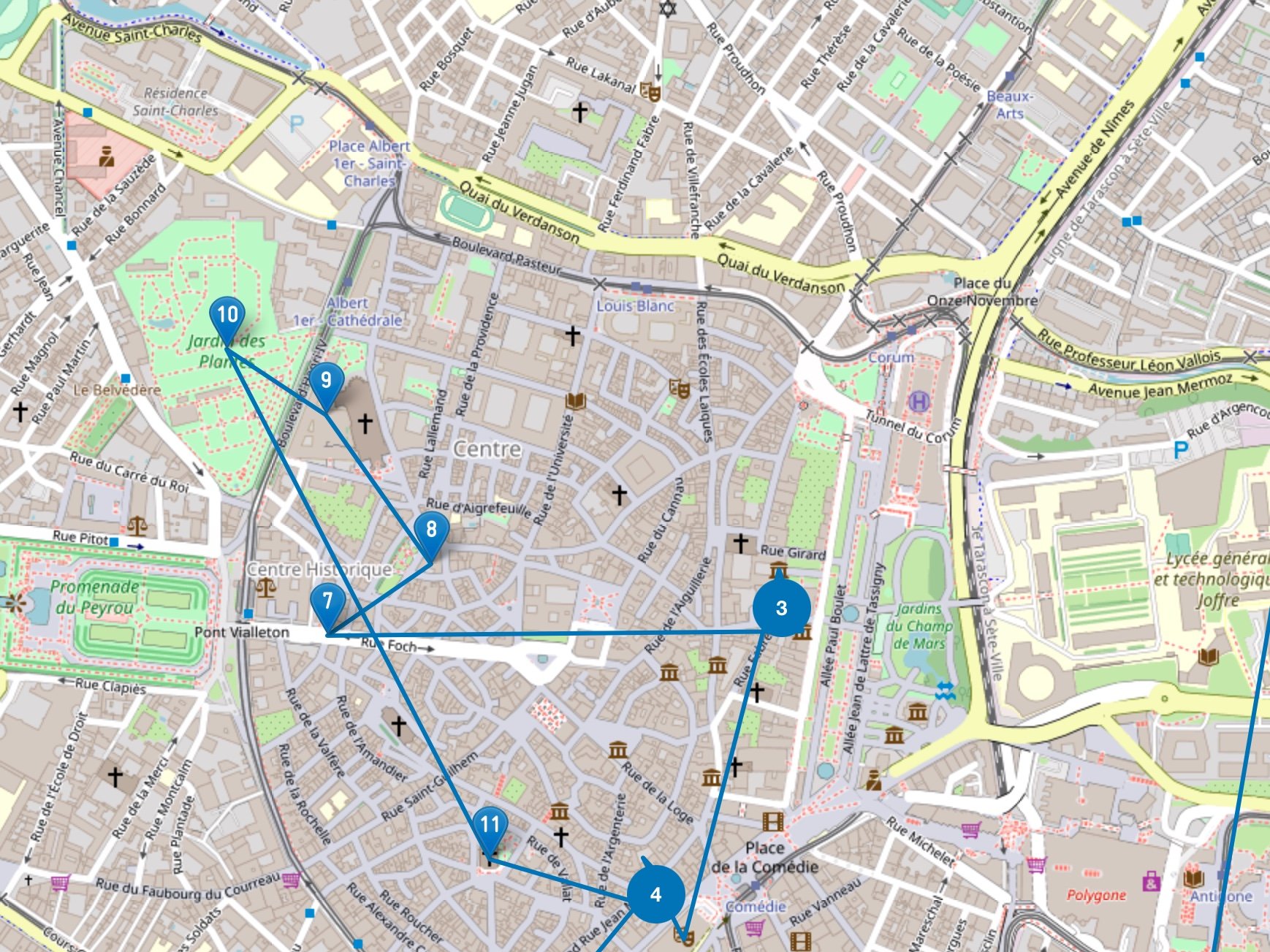 L'image montre une carte détaillée d'une ville, avec un accent sur un secteur central. On peut y voir divers points d'intérêt, numérotés de 1 à 16, connectés par des lignes bleues. Ces points pourraient représenter des lieux spécifiques, des attractions touristiques ou des étapes d'un itinéraire. La carte comprend également des rues, des bâtiments et peut-être des parcs ou d'autres éléments géographiques.