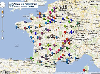 L'image montre une carte de la France et des pays environnants, avec plusieurs épingles de différentes couleurs. Chaque épingle semble représenter un emplacement lié à l'organisation "Secours Catholique". On peut voir des indications pour la Belgique et d'autres régions. La carte comprend des légendes et des informations géographiques, suggérant un réseau d'activités ou de points d'intérêt pour cette organisation. Les couleurs des épingles pourraient indiquer différentes catégories ou types d'initiatives.