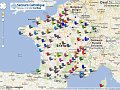 L'image montre une carte de la France et des pays environnants, avec plusieurs épingles de différentes couleurs. Chaque épingle semble représenter un emplacement lié à l'organisation "Secours Catholique". On peut voir des indications pour la Belgique et d'autres régions. La carte comprend des légendes et des informations géographiques, suggérant un réseau d'activités ou de points d'intérêt pour cette organisation. Les couleurs des épingles pourraient indiquer différentes catégories ou types d'initiatives.