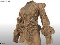L'image montre un manteau ou une veste au design avant-gardiste. Ce vêtement est largement orné de motifs texturés en relief, créant un effet sculptural. Les formes ondulées et les détails en spirale ajoutent de la profondeur et du volume à l'ensemble, tandis que la couleur beige neutre contribue à l'élégance de la pièce. La coupe est moderne, avec des manches larges, ce qui renforce le caractère audacieux de cette création.